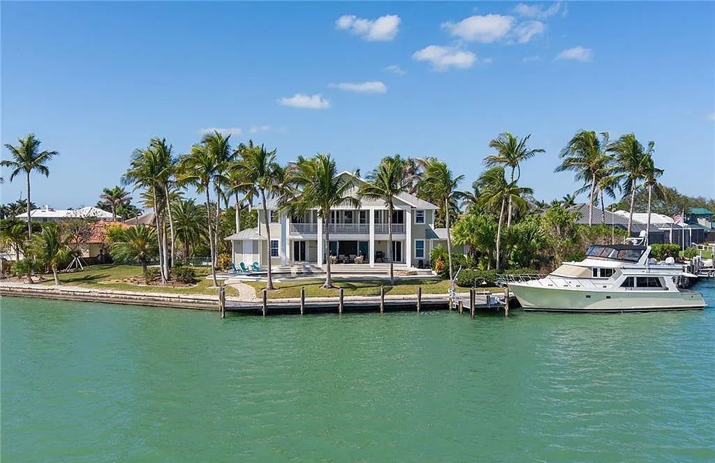 Nestled in Marco Island's prestigious Estate section, 581 Conover Ct is a waterfront gem offering 247' of direct access frontage on Roberts Bay with 11' elevation. This 2000-built Slocum & Christian home boasts an open - living concept, three bedrooms, three baths, and breathtaking water views from every room.