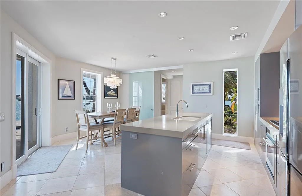 Nestled in Marco Island's prestigious Estate section, 581 Conover Ct is a waterfront gem offering 247' of direct access frontage on Roberts Bay with 11' elevation. This 2000-built Slocum & Christian home boasts an open - living concept, three bedrooms, three baths, and breathtaking water views from every room.