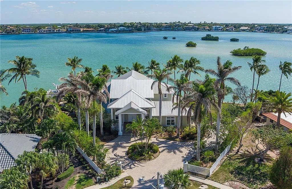 Nestled in Marco Island's prestigious Estate section, 581 Conover Ct is a waterfront gem offering 247' of direct access frontage on Roberts Bay with 11' elevation. This 2000-built Slocum & Christian home boasts an open - living concept, three bedrooms, three baths, and breathtaking water views from every room.