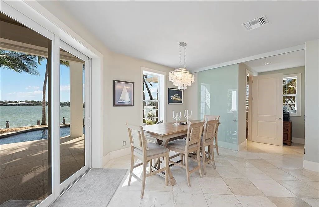 Nestled in Marco Island's prestigious Estate section, 581 Conover Ct is a waterfront gem offering 247' of direct access frontage on Roberts Bay with 11' elevation. This 2000-built Slocum & Christian home boasts an open - living concept, three bedrooms, three baths, and breathtaking water views from every room.