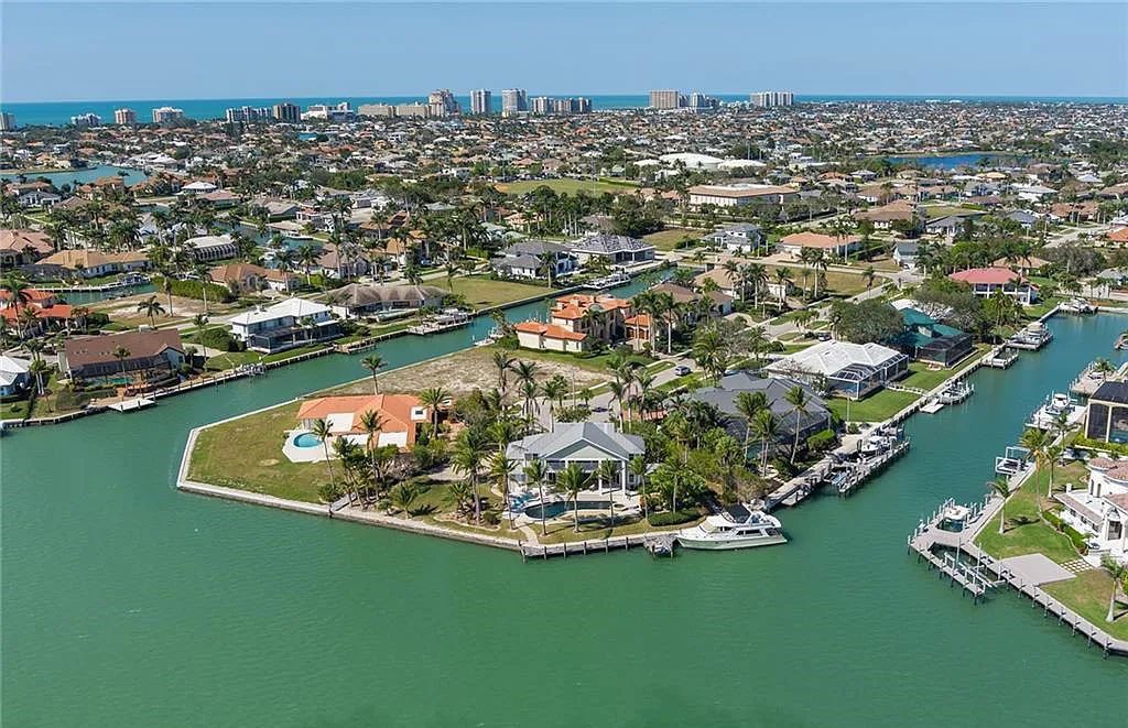 Nestled in Marco Island's prestigious Estate section, 581 Conover Ct is a waterfront gem offering 247' of direct access frontage on Roberts Bay with 11' elevation. This 2000-built Slocum & Christian home boasts an open - living concept, three bedrooms, three baths, and breathtaking water views from every room.