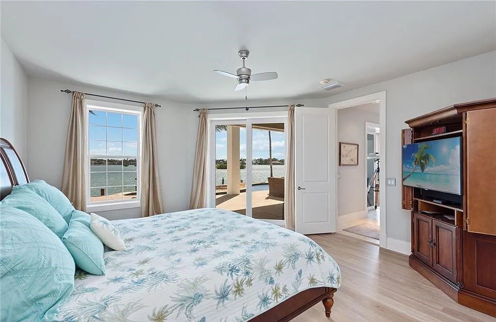 Nestled in Marco Island's prestigious Estate section, 581 Conover Ct is a waterfront gem offering 247' of direct access frontage on Roberts Bay with 11' elevation. This 2000-built Slocum & Christian home boasts an open - living concept, three bedrooms, three baths, and breathtaking water views from every room.