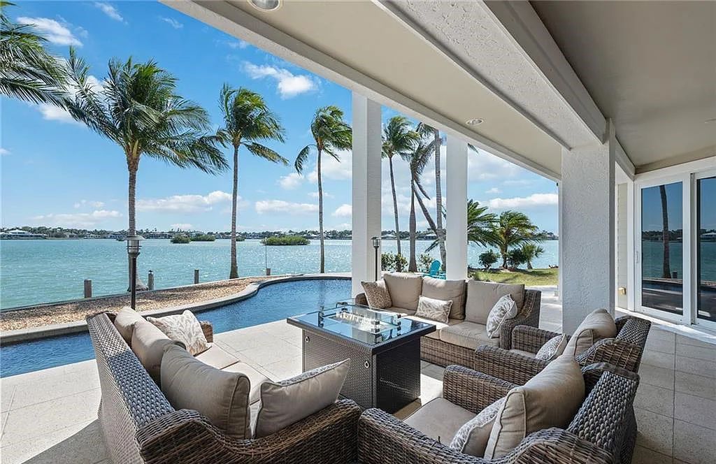 Nestled in Marco Island's prestigious Estate section, 581 Conover Ct is a waterfront gem offering 247' of direct access frontage on Roberts Bay with 11' elevation. This 2000-built Slocum & Christian home boasts an open - living concept, three bedrooms, three baths, and breathtaking water views from every room.