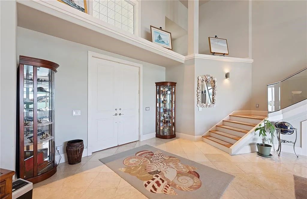 Nestled in Marco Island's prestigious Estate section, 581 Conover Ct is a waterfront gem offering 247' of direct access frontage on Roberts Bay with 11' elevation. This 2000-built Slocum & Christian home boasts an open - living concept, three bedrooms, three baths, and breathtaking water views from every room.