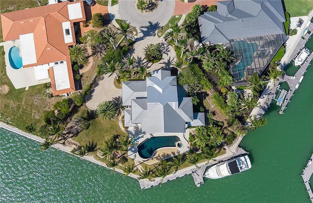 Nestled in Marco Island's prestigious Estate section, 581 Conover Ct is a waterfront gem offering 247' of direct access frontage on Roberts Bay with 11' elevation. This 2000-built Slocum & Christian home boasts an open - living concept, three bedrooms, three baths, and breathtaking water views from every room.