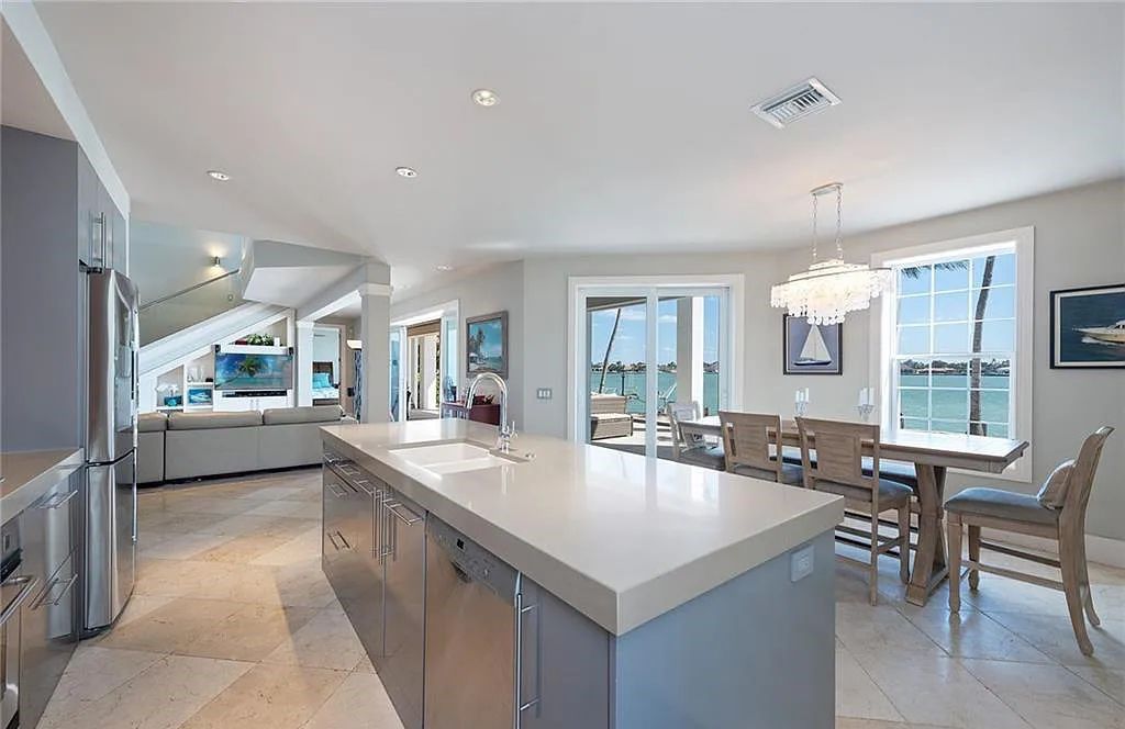 Nestled in Marco Island's prestigious Estate section, 581 Conover Ct is a waterfront gem offering 247' of direct access frontage on Roberts Bay with 11' elevation. This 2000-built Slocum & Christian home boasts an open - living concept, three bedrooms, three baths, and breathtaking water views from every room.