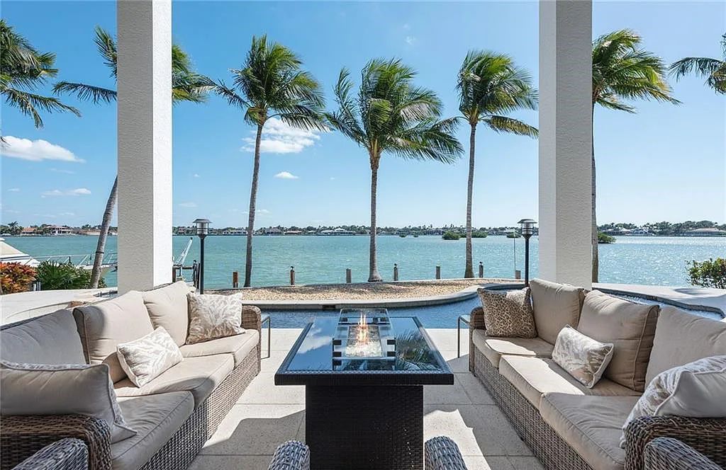 Nestled in Marco Island's prestigious Estate section, 581 Conover Ct is a waterfront gem offering 247' of direct access frontage on Roberts Bay with 11' elevation. This 2000-built Slocum & Christian home boasts an open - living concept, three bedrooms, three baths, and breathtaking water views from every room.