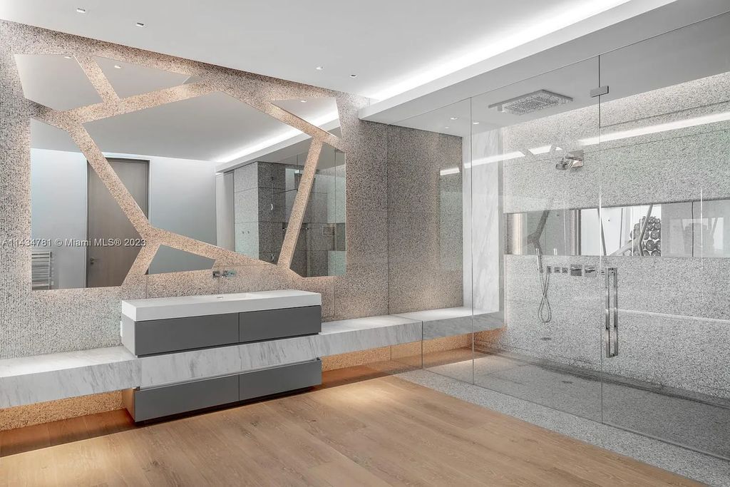 Nestled on the exclusive Star Island in Miami Beach, this 2019-built estate at 27 Star Island Drive is the epitome of luxury living. With 9 bedrooms and 12 bathrooms, the meticulously crafted interiors span nearly 23,000 square feet, showcasing a breathtaking 21-foot-high ceiling salon, a chef's dream kitchen, and multiple entertainment spaces, including two media rooms.