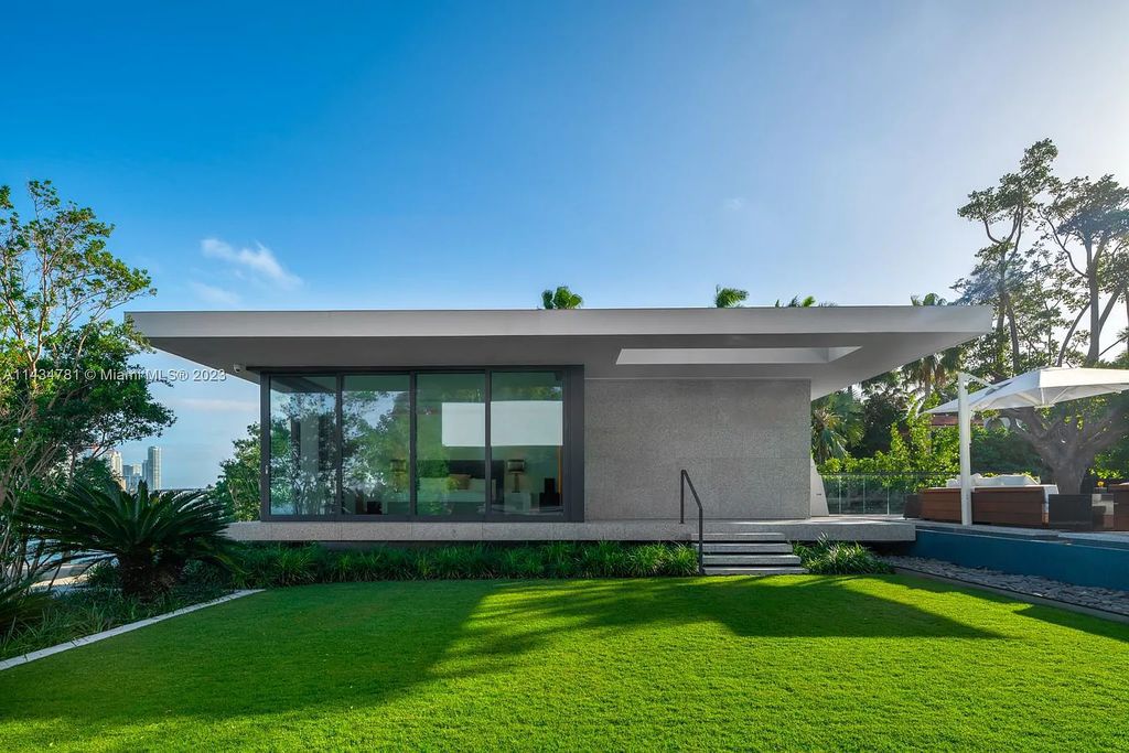 Nestled on the exclusive Star Island in Miami Beach, this 2019-built estate at 27 Star Island Drive is the epitome of luxury living. With 9 bedrooms and 12 bathrooms, the meticulously crafted interiors span nearly 23,000 square feet, showcasing a breathtaking 21-foot-high ceiling salon, a chef's dream kitchen, and multiple entertainment spaces, including two media rooms.