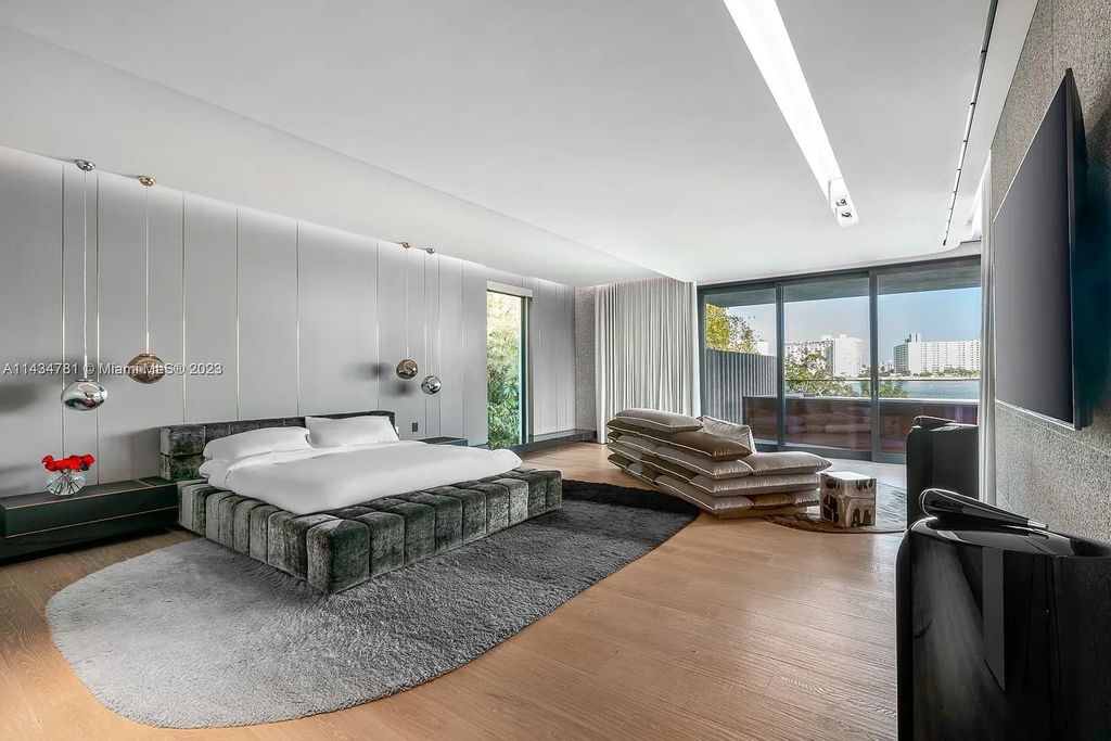 Nestled on the exclusive Star Island in Miami Beach, this 2019-built estate at 27 Star Island Drive is the epitome of luxury living. With 9 bedrooms and 12 bathrooms, the meticulously crafted interiors span nearly 23,000 square feet, showcasing a breathtaking 21-foot-high ceiling salon, a chef's dream kitchen, and multiple entertainment spaces, including two media rooms.