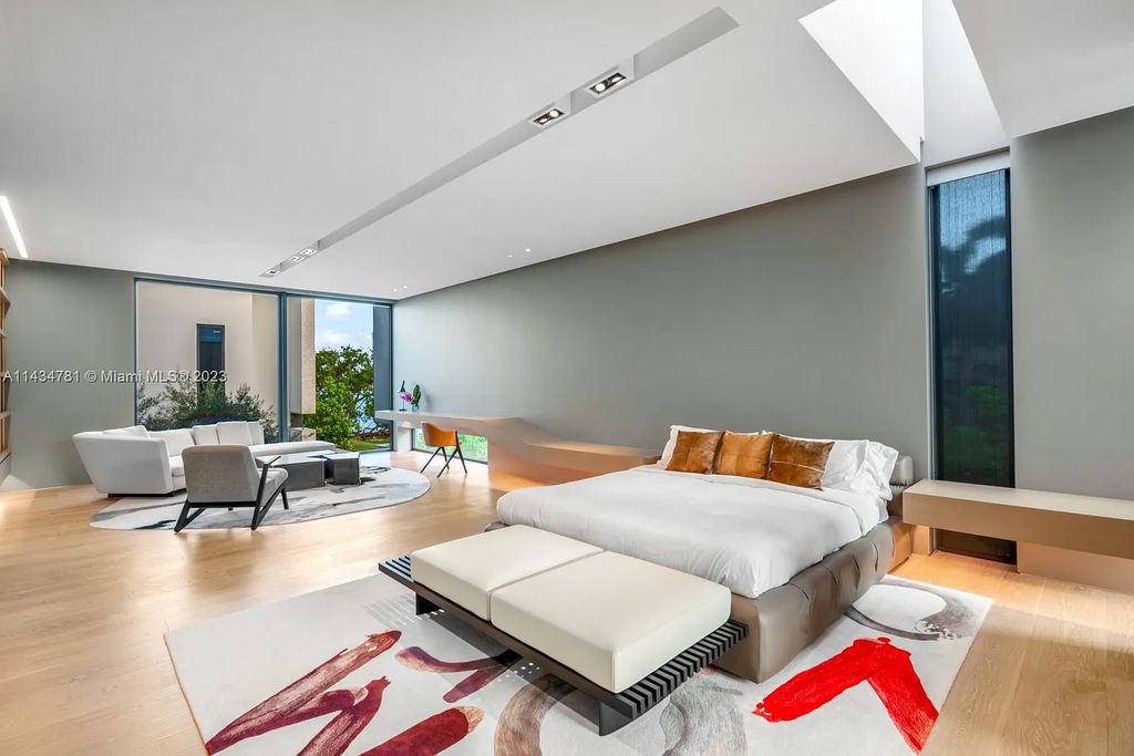 Nestled on the exclusive Star Island in Miami Beach, this 2019-built estate at 27 Star Island Drive is the epitome of luxury living. With 9 bedrooms and 12 bathrooms, the meticulously crafted interiors span nearly 23,000 square feet, showcasing a breathtaking 21-foot-high ceiling salon, a chef's dream kitchen, and multiple entertainment spaces, including two media rooms.