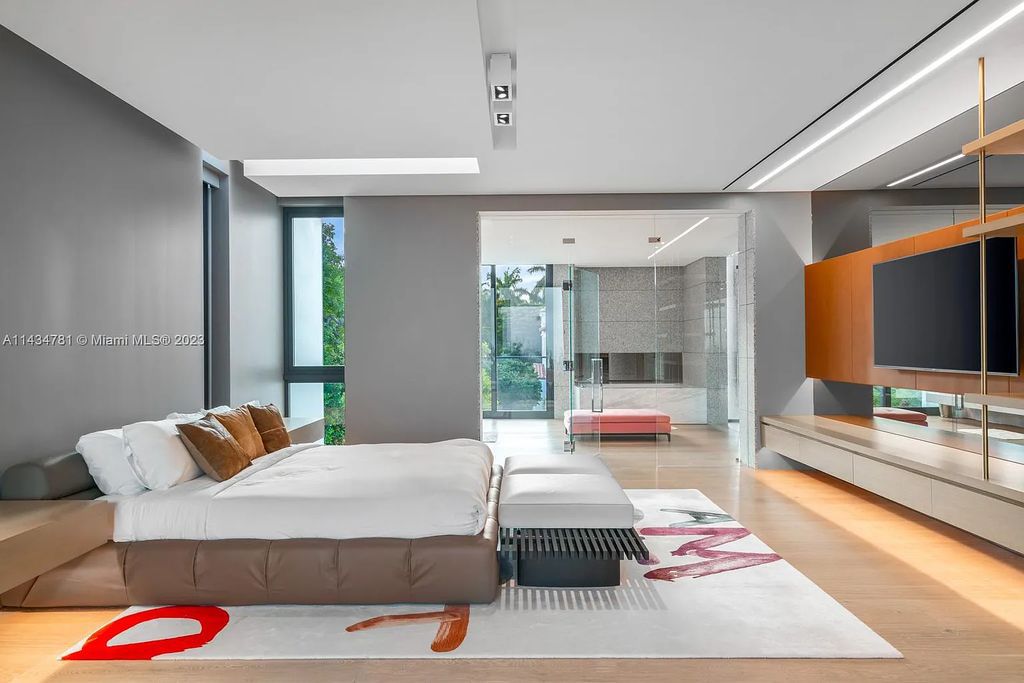 Nestled on the exclusive Star Island in Miami Beach, this 2019-built estate at 27 Star Island Drive is the epitome of luxury living. With 9 bedrooms and 12 bathrooms, the meticulously crafted interiors span nearly 23,000 square feet, showcasing a breathtaking 21-foot-high ceiling salon, a chef's dream kitchen, and multiple entertainment spaces, including two media rooms.
