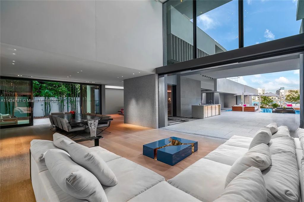 Nestled on the exclusive Star Island in Miami Beach, this 2019-built estate at 27 Star Island Drive is the epitome of luxury living. With 9 bedrooms and 12 bathrooms, the meticulously crafted interiors span nearly 23,000 square feet, showcasing a breathtaking 21-foot-high ceiling salon, a chef's dream kitchen, and multiple entertainment spaces, including two media rooms.