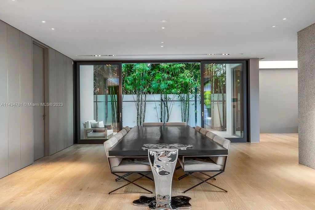Nestled on the exclusive Star Island in Miami Beach, this 2019-built estate at 27 Star Island Drive is the epitome of luxury living. With 9 bedrooms and 12 bathrooms, the meticulously crafted interiors span nearly 23,000 square feet, showcasing a breathtaking 21-foot-high ceiling salon, a chef's dream kitchen, and multiple entertainment spaces, including two media rooms.