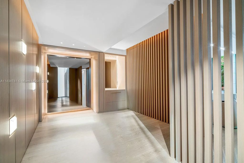 Nestled on the exclusive Star Island in Miami Beach, this 2019-built estate at 27 Star Island Drive is the epitome of luxury living. With 9 bedrooms and 12 bathrooms, the meticulously crafted interiors span nearly 23,000 square feet, showcasing a breathtaking 21-foot-high ceiling salon, a chef's dream kitchen, and multiple entertainment spaces, including two media rooms.