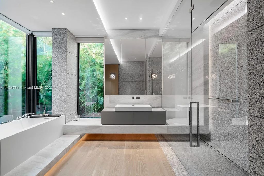 Nestled on the exclusive Star Island in Miami Beach, this 2019-built estate at 27 Star Island Drive is the epitome of luxury living. With 9 bedrooms and 12 bathrooms, the meticulously crafted interiors span nearly 23,000 square feet, showcasing a breathtaking 21-foot-high ceiling salon, a chef's dream kitchen, and multiple entertainment spaces, including two media rooms.