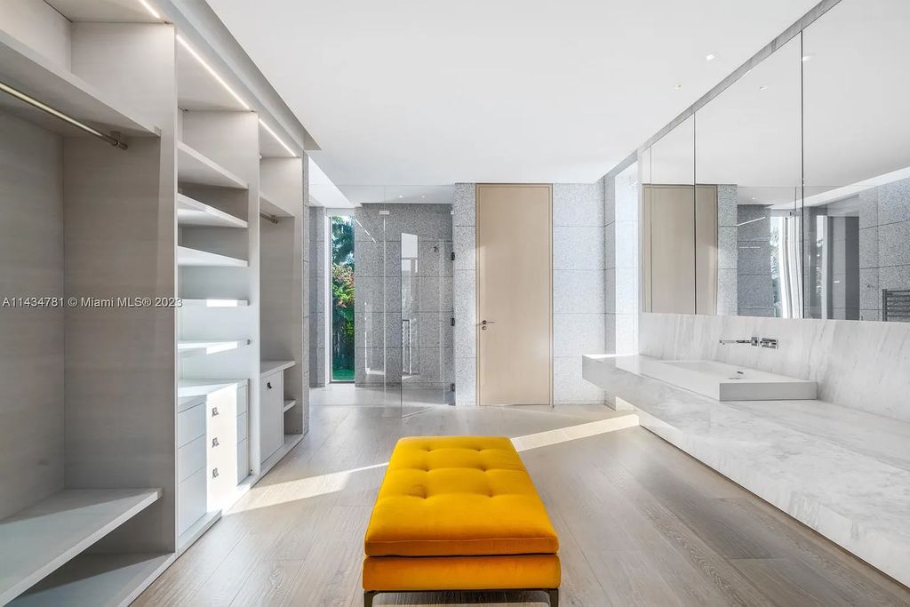 Nestled on the exclusive Star Island in Miami Beach, this 2019-built estate at 27 Star Island Drive is the epitome of luxury living. With 9 bedrooms and 12 bathrooms, the meticulously crafted interiors span nearly 23,000 square feet, showcasing a breathtaking 21-foot-high ceiling salon, a chef's dream kitchen, and multiple entertainment spaces, including two media rooms.