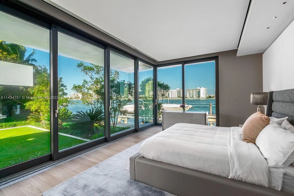 Nestled on the exclusive Star Island in Miami Beach, this 2019-built estate at 27 Star Island Drive is the epitome of luxury living. With 9 bedrooms and 12 bathrooms, the meticulously crafted interiors span nearly 23,000 square feet, showcasing a breathtaking 21-foot-high ceiling salon, a chef's dream kitchen, and multiple entertainment spaces, including two media rooms.