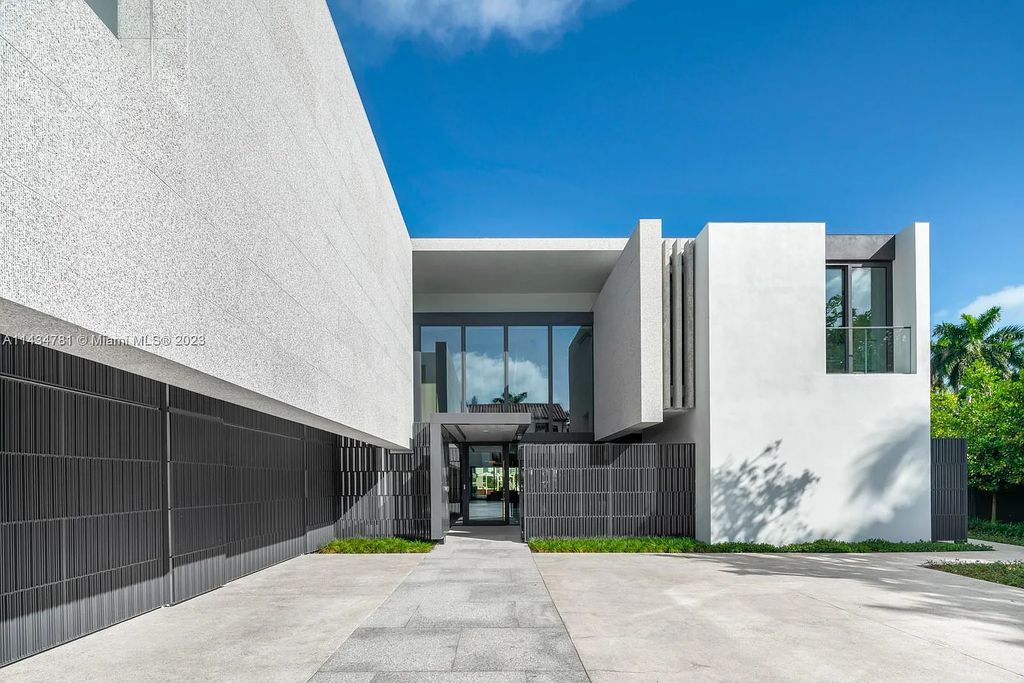 Nestled on the exclusive Star Island in Miami Beach, this 2019-built estate at 27 Star Island Drive is the epitome of luxury living. With 9 bedrooms and 12 bathrooms, the meticulously crafted interiors span nearly 23,000 square feet, showcasing a breathtaking 21-foot-high ceiling salon, a chef's dream kitchen, and multiple entertainment spaces, including two media rooms.