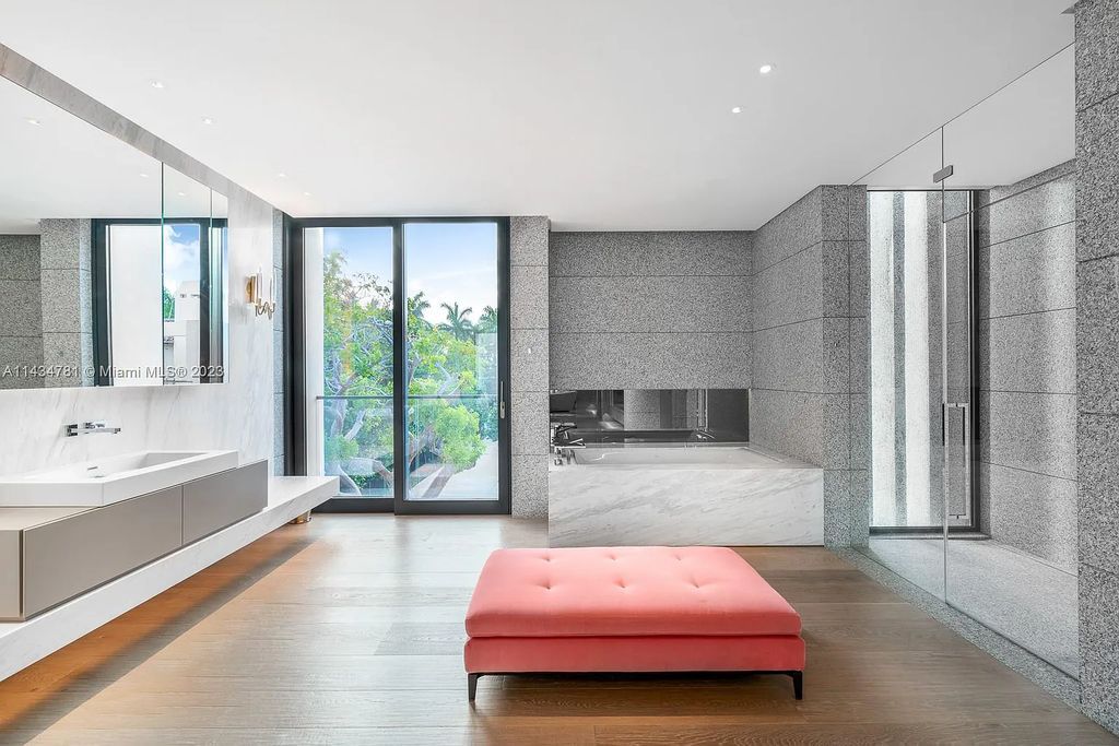 Nestled on the exclusive Star Island in Miami Beach, this 2019-built estate at 27 Star Island Drive is the epitome of luxury living. With 9 bedrooms and 12 bathrooms, the meticulously crafted interiors span nearly 23,000 square feet, showcasing a breathtaking 21-foot-high ceiling salon, a chef's dream kitchen, and multiple entertainment spaces, including two media rooms.
