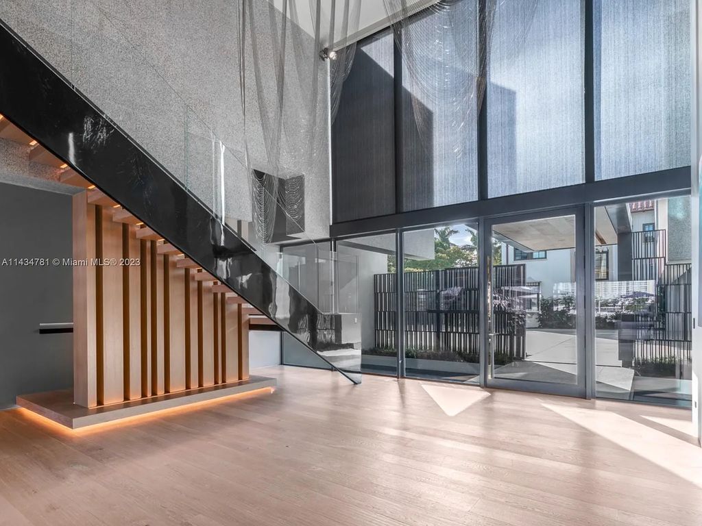 Nestled on the exclusive Star Island in Miami Beach, this 2019-built estate at 27 Star Island Drive is the epitome of luxury living. With 9 bedrooms and 12 bathrooms, the meticulously crafted interiors span nearly 23,000 square feet, showcasing a breathtaking 21-foot-high ceiling salon, a chef's dream kitchen, and multiple entertainment spaces, including two media rooms.