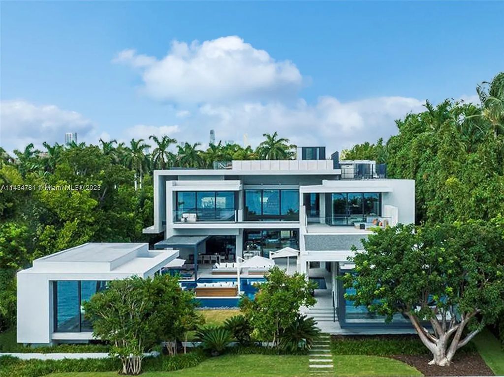 Nestled on the exclusive Star Island in Miami Beach, this 2019-built estate at 27 Star Island Drive is the epitome of luxury living. With 9 bedrooms and 12 bathrooms, the meticulously crafted interiors span nearly 23,000 square feet, showcasing a breathtaking 21-foot-high ceiling salon, a chef's dream kitchen, and multiple entertainment spaces, including two media rooms.