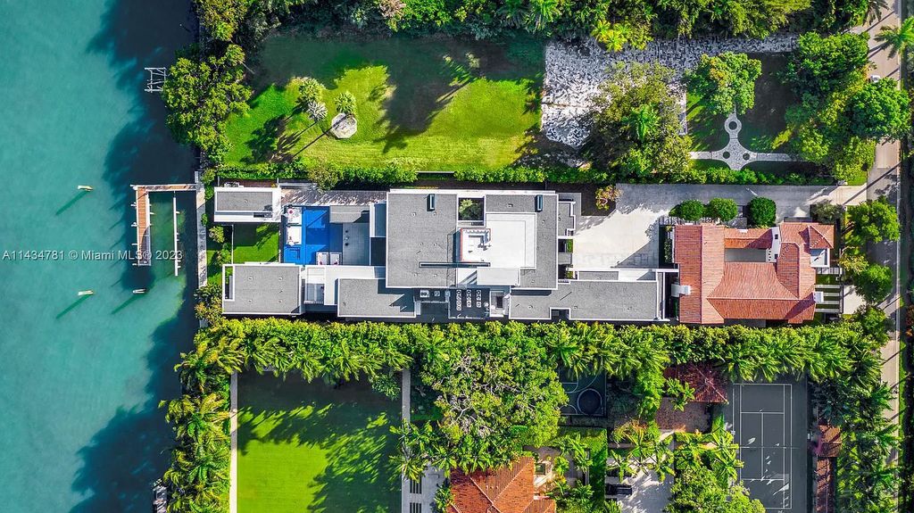 Nestled on the exclusive Star Island in Miami Beach, this 2019-built estate at 27 Star Island Drive is the epitome of luxury living. With 9 bedrooms and 12 bathrooms, the meticulously crafted interiors span nearly 23,000 square feet, showcasing a breathtaking 21-foot-high ceiling salon, a chef's dream kitchen, and multiple entertainment spaces, including two media rooms.