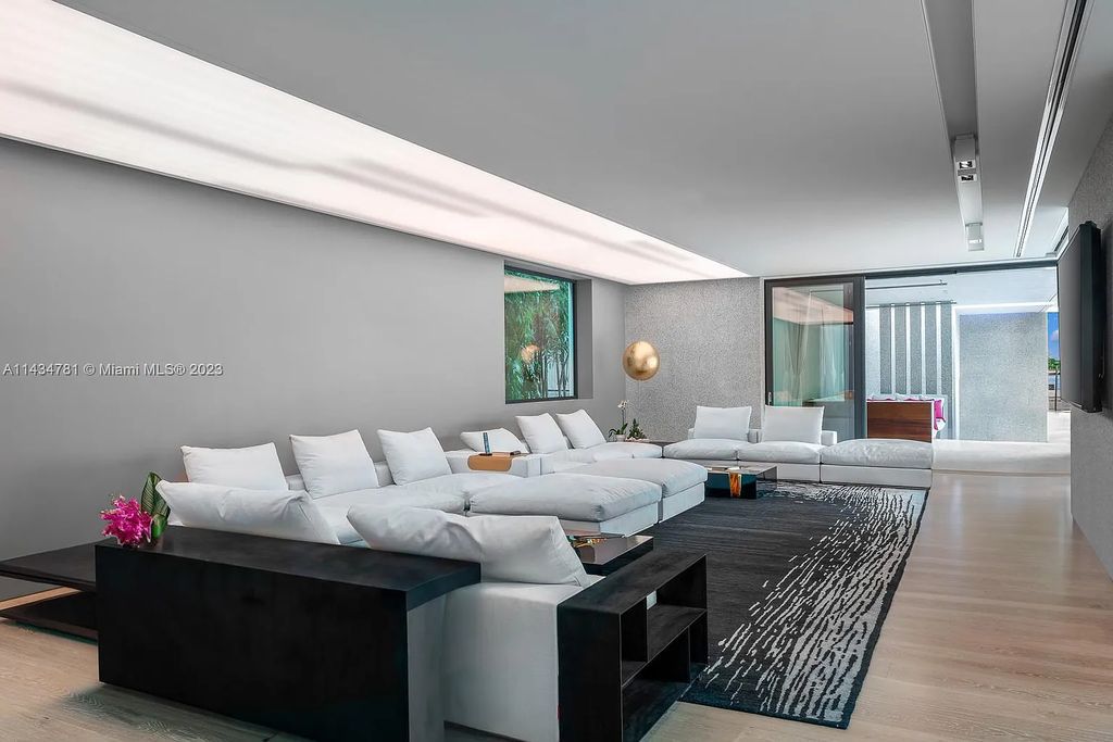 Nestled on the exclusive Star Island in Miami Beach, this 2019-built estate at 27 Star Island Drive is the epitome of luxury living. With 9 bedrooms and 12 bathrooms, the meticulously crafted interiors span nearly 23,000 square feet, showcasing a breathtaking 21-foot-high ceiling salon, a chef's dream kitchen, and multiple entertainment spaces, including two media rooms.