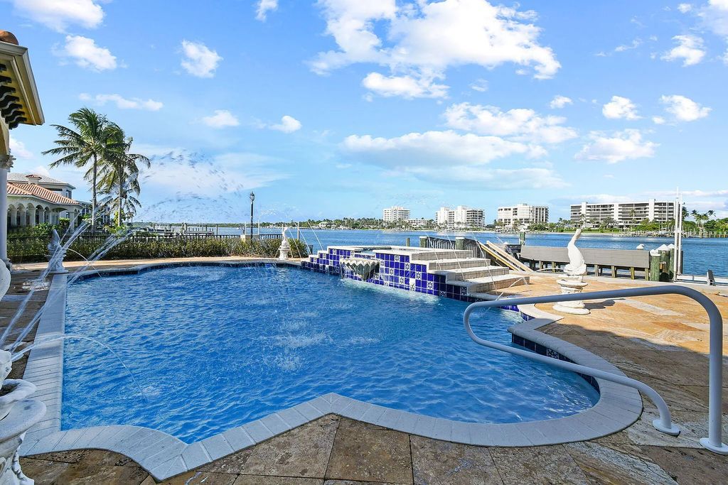 Discover unparalleled waterfront living at 19709 Harbor Road, Jupiter, Florida. This exquisite 3-bedroom, 4-bathroom estate, spanning 5,319 square feet on a 0.37-acre lot, presents breathtaking Intracoastal Waterway views.