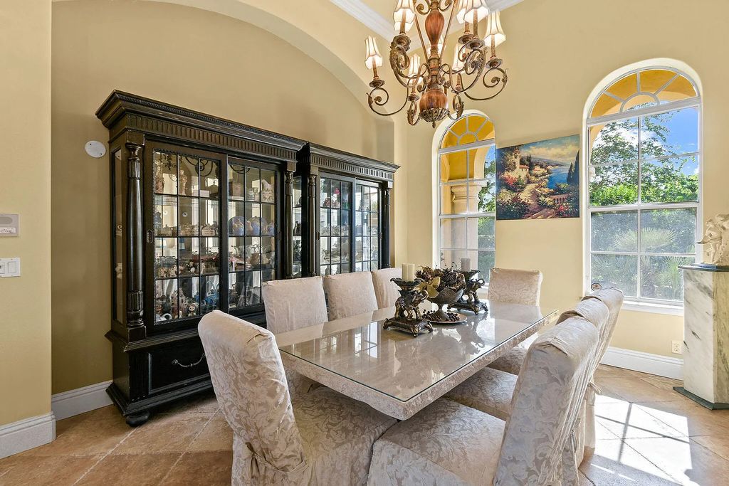 Discover unparalleled waterfront living at 19709 Harbor Road, Jupiter, Florida. This exquisite 3-bedroom, 4-bathroom estate, spanning 5,319 square feet on a 0.37-acre lot, presents breathtaking Intracoastal Waterway views.