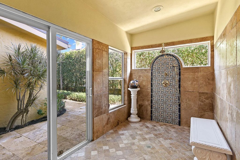 Discover unparalleled waterfront living at 19709 Harbor Road, Jupiter, Florida. This exquisite 3-bedroom, 4-bathroom estate, spanning 5,319 square feet on a 0.37-acre lot, presents breathtaking Intracoastal Waterway views.