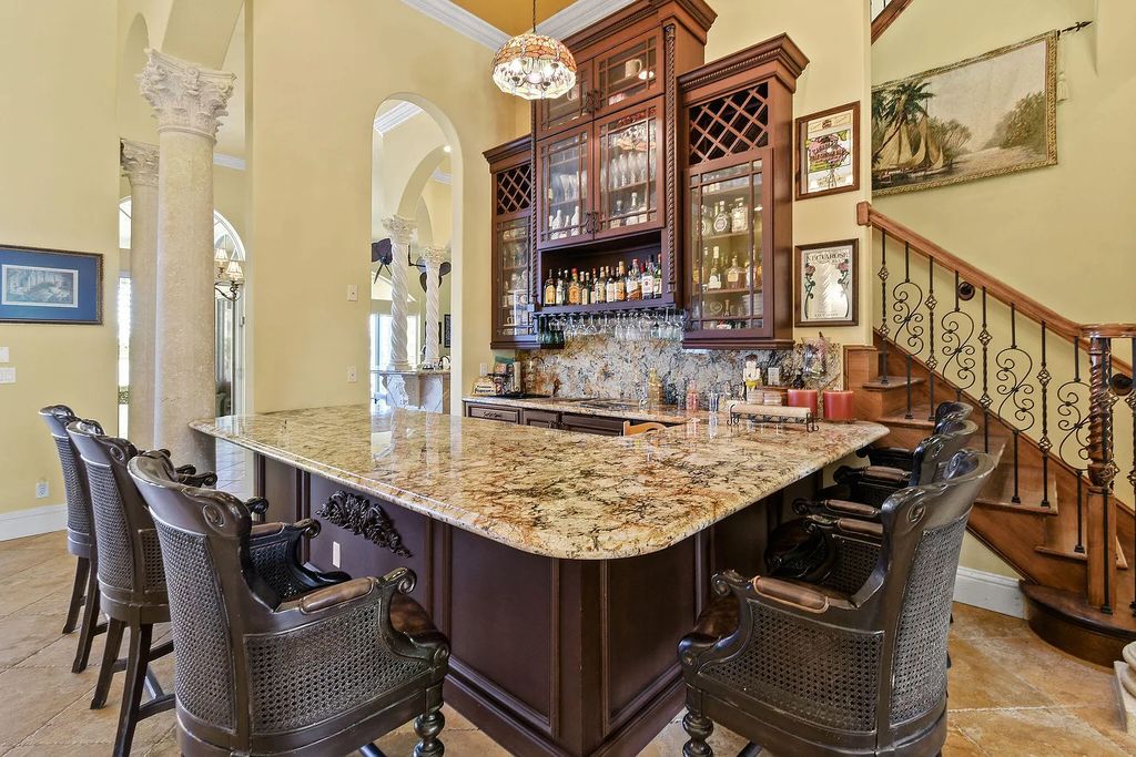 Discover unparalleled waterfront living at 19709 Harbor Road, Jupiter, Florida. This exquisite 3-bedroom, 4-bathroom estate, spanning 5,319 square feet on a 0.37-acre lot, presents breathtaking Intracoastal Waterway views.
