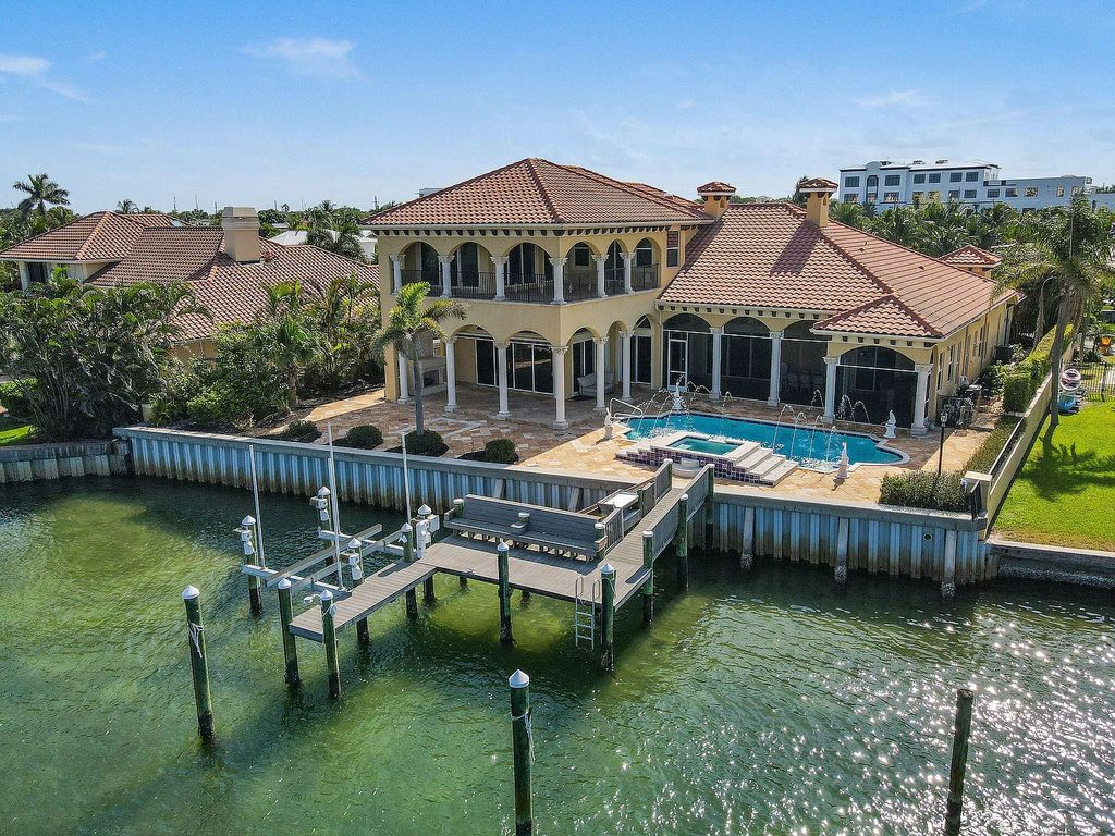 Discover unparalleled waterfront living at 19709 Harbor Road, Jupiter, Florida. This exquisite 3-bedroom, 4-bathroom estate, spanning 5,319 square feet on a 0.37-acre lot, presents breathtaking Intracoastal Waterway views.