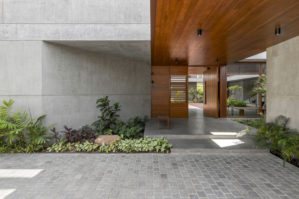 The Monolithic House Features Open & Green Spaces by MODO Designs