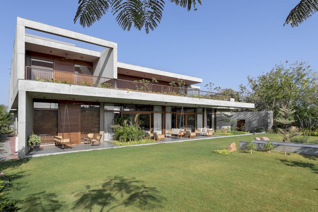 The Monolithic House Features Open & Green Spaces by MODO Designs