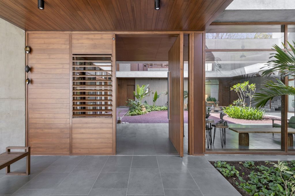 The Monolithic House Features Open & Green Spaces by MODO Designs