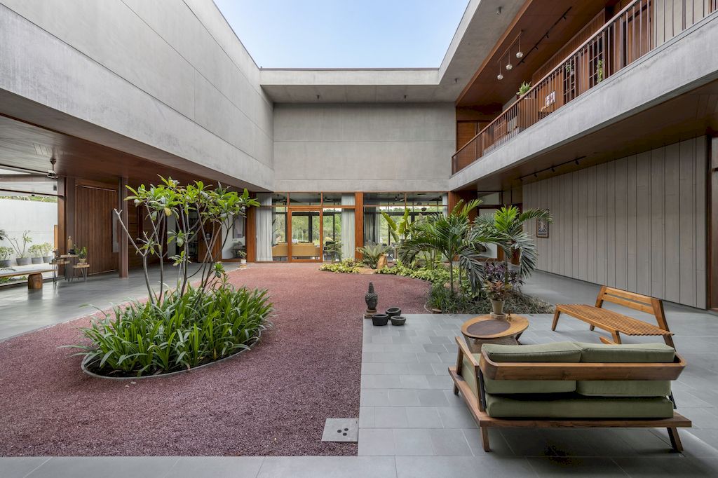 The Monolithic House Features Open & Green Spaces by MODO Designs
