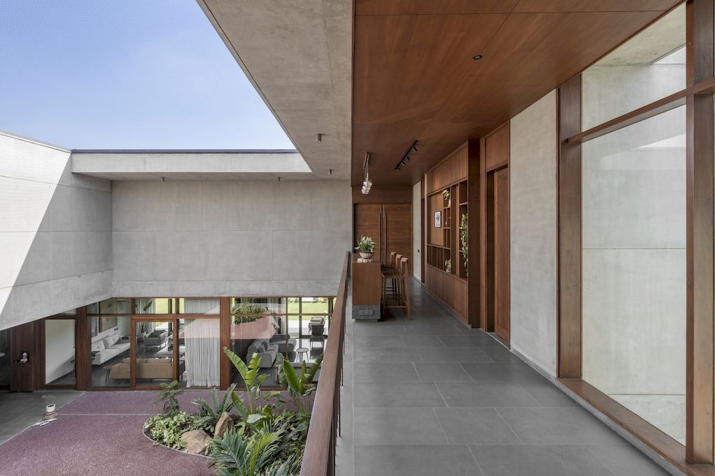 The Monolithic House Features Open & Green Spaces by MODO Designs