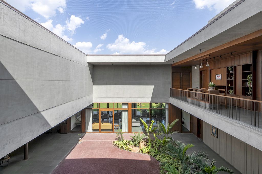 The Monolithic House Features Open & Green Spaces by MODO Designs