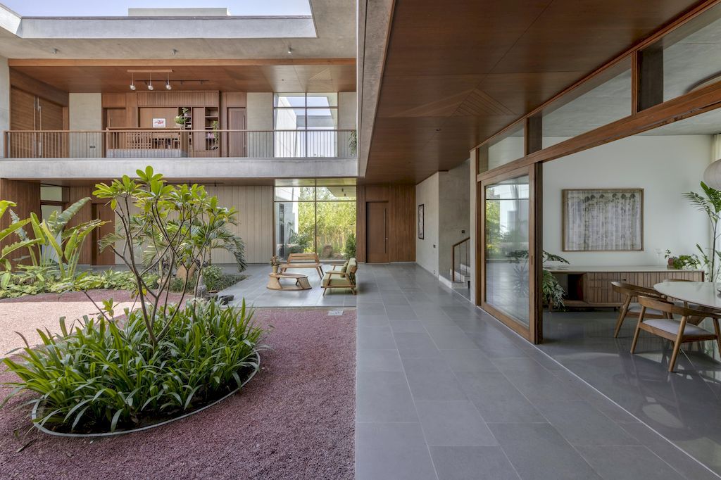 The Monolithic House Features Open & Green Spaces by MODO Designs