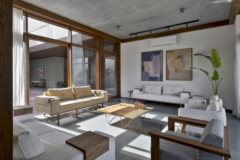 The Monolithic House Features Open & Green Spaces by MODO Designs
