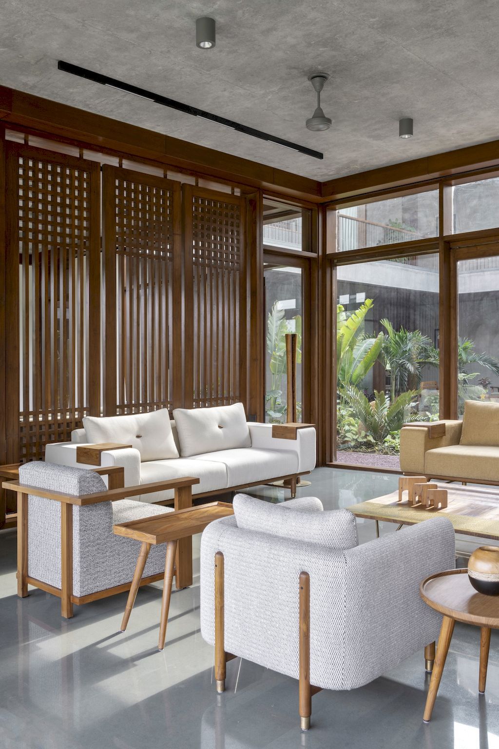 The Monolithic House Features Open & Green Spaces by MODO Designs