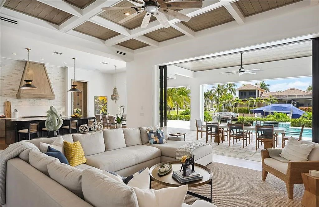 Experience the epitome of waterfront luxury at 541 Hammock Ct, Marco Island, Florida. Built in 2020 in the prestigious Coastal Contemporary Estates area, this home boasts grandeur with a 30-foot foyer ceiling and breathtaking water views.
