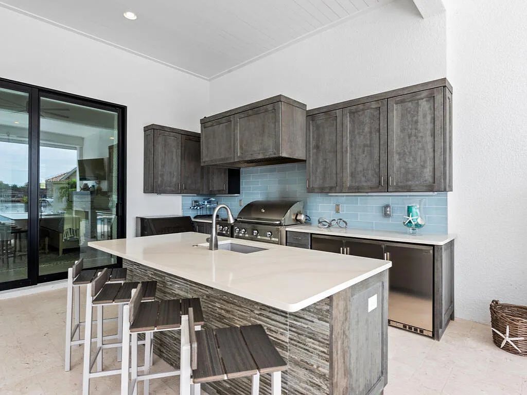 Discover waterfront perfection at 681 Crescent St, Marco Island, FL. This 2020-built, lightly lived-in masterpiece offers 4 bedrooms, 5 baths, and 4,047 square feet of luxury living. Its open split floor plan seamlessly blends indoor and outdoor spaces, revealing breathtaking bay views.