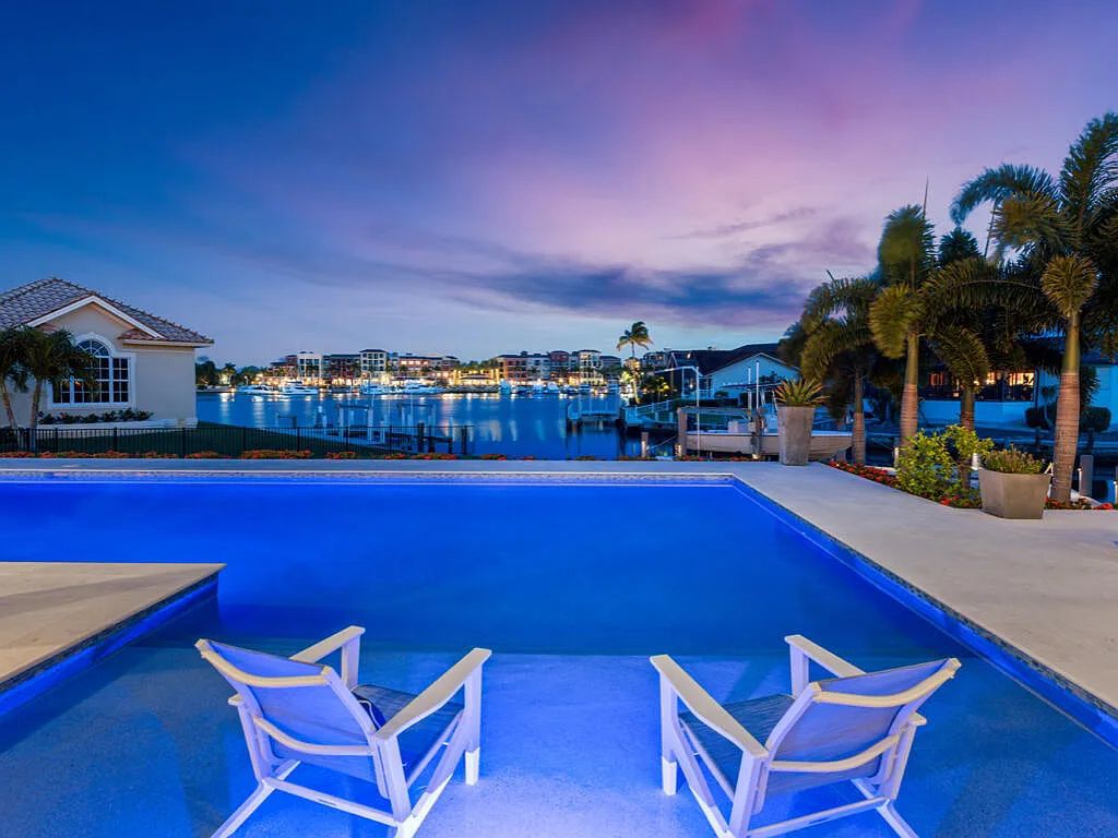 Discover waterfront perfection at 681 Crescent St, Marco Island, FL. This 2020-built, lightly lived-in masterpiece offers 4 bedrooms, 5 baths, and 4,047 square feet of luxury living. Its open split floor plan seamlessly blends indoor and outdoor spaces, revealing breathtaking bay views.