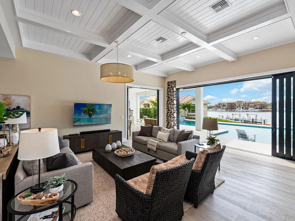 Discover waterfront perfection at 681 Crescent St, Marco Island, FL. This 2020-built, lightly lived-in masterpiece offers 4 bedrooms, 5 baths, and 4,047 square feet of luxury living. Its open split floor plan seamlessly blends indoor and outdoor spaces, revealing breathtaking bay views.