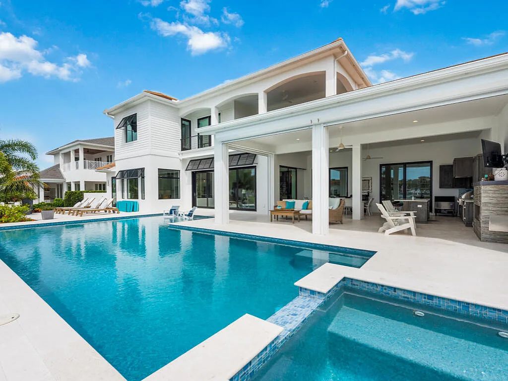 Discover waterfront perfection at 681 Crescent St, Marco Island, FL. This 2020-built, lightly lived-in masterpiece offers 4 bedrooms, 5 baths, and 4,047 square feet of luxury living. Its open split floor plan seamlessly blends indoor and outdoor spaces, revealing breathtaking bay views.