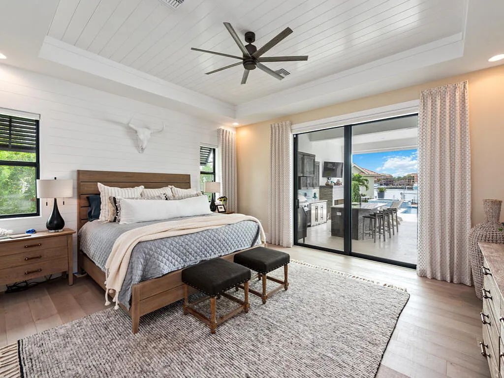 Discover waterfront perfection at 681 Crescent St, Marco Island, FL. This 2020-built, lightly lived-in masterpiece offers 4 bedrooms, 5 baths, and 4,047 square feet of luxury living. Its open split floor plan seamlessly blends indoor and outdoor spaces, revealing breathtaking bay views.