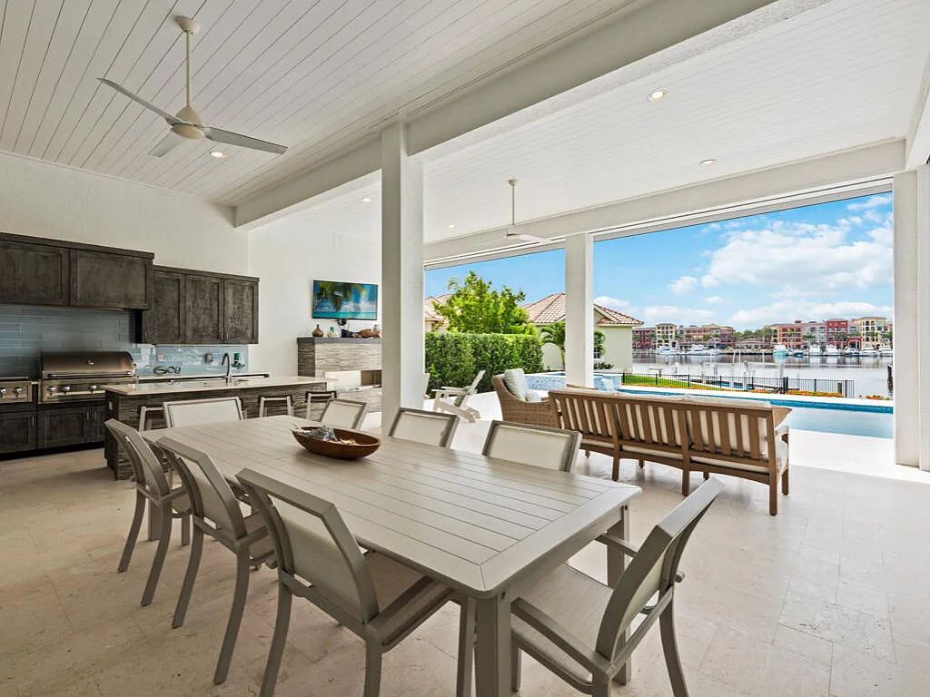 Discover waterfront perfection at 681 Crescent St, Marco Island, FL. This 2020-built, lightly lived-in masterpiece offers 4 bedrooms, 5 baths, and 4,047 square feet of luxury living. Its open split floor plan seamlessly blends indoor and outdoor spaces, revealing breathtaking bay views.
