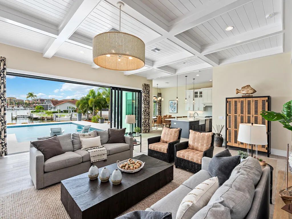 Discover waterfront perfection at 681 Crescent St, Marco Island, FL. This 2020-built, lightly lived-in masterpiece offers 4 bedrooms, 5 baths, and 4,047 square feet of luxury living. Its open split floor plan seamlessly blends indoor and outdoor spaces, revealing breathtaking bay views.